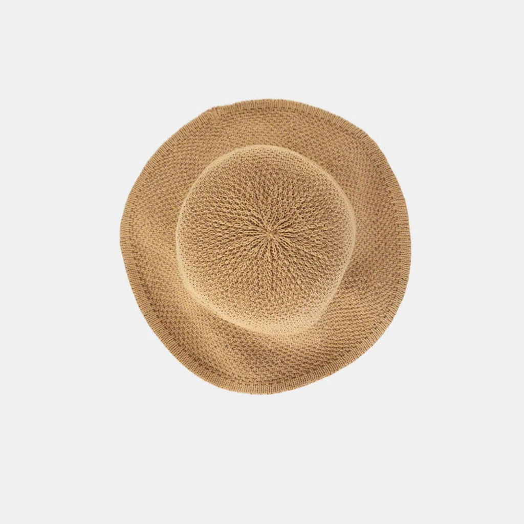 Beige woven hat on a light gray background