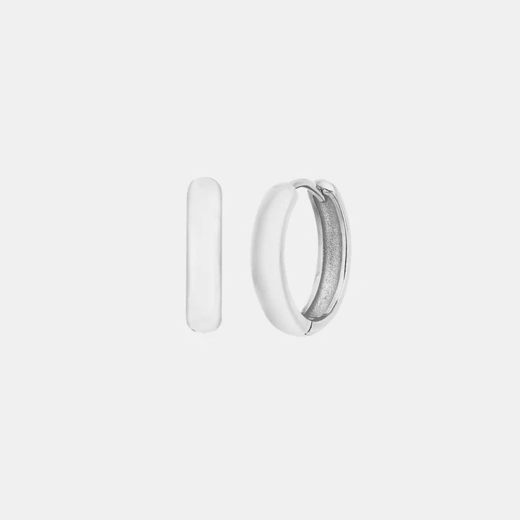Silver hoop earrings on a light gray background