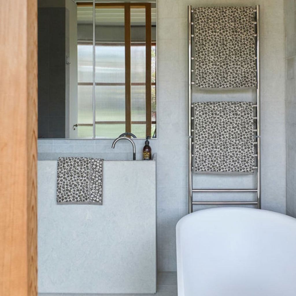 Bathroom interior with a sink, mirror, and towel radiator.