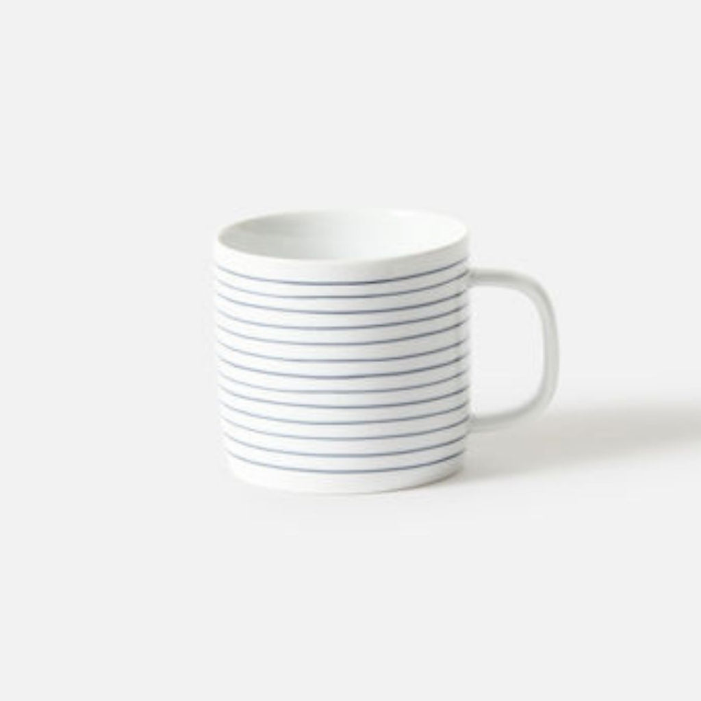 White mug with black stripes on a white background