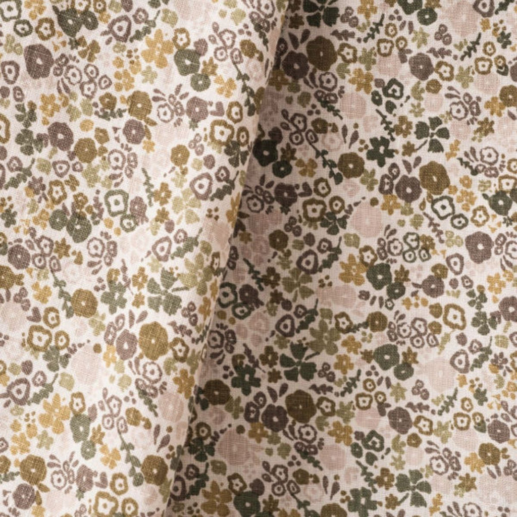Floral patterned fabric with small flowers in brown, green, and beige on a beige background.