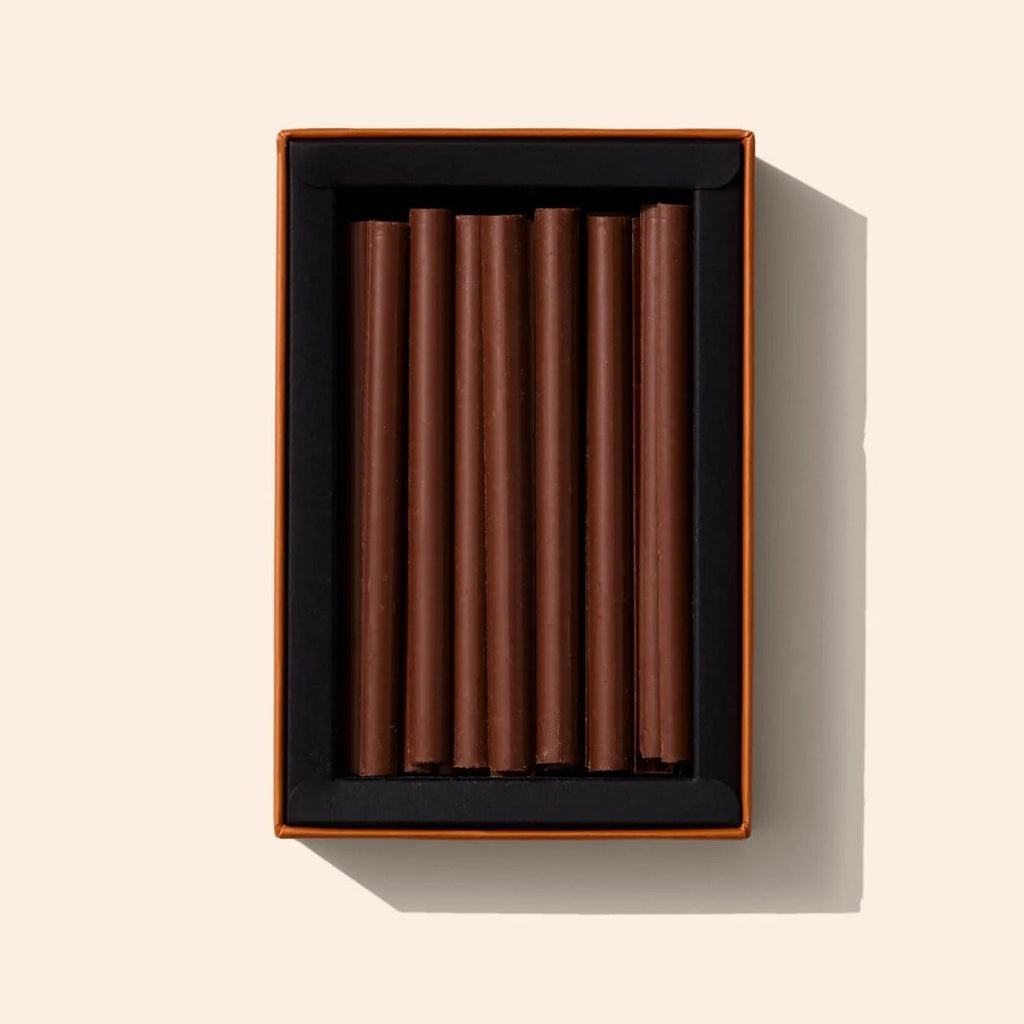 Box of chocolate bars on a beige background