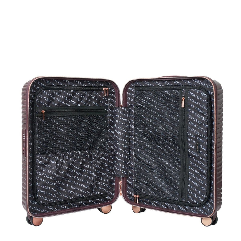Open suitcase with patterned interior on a white background