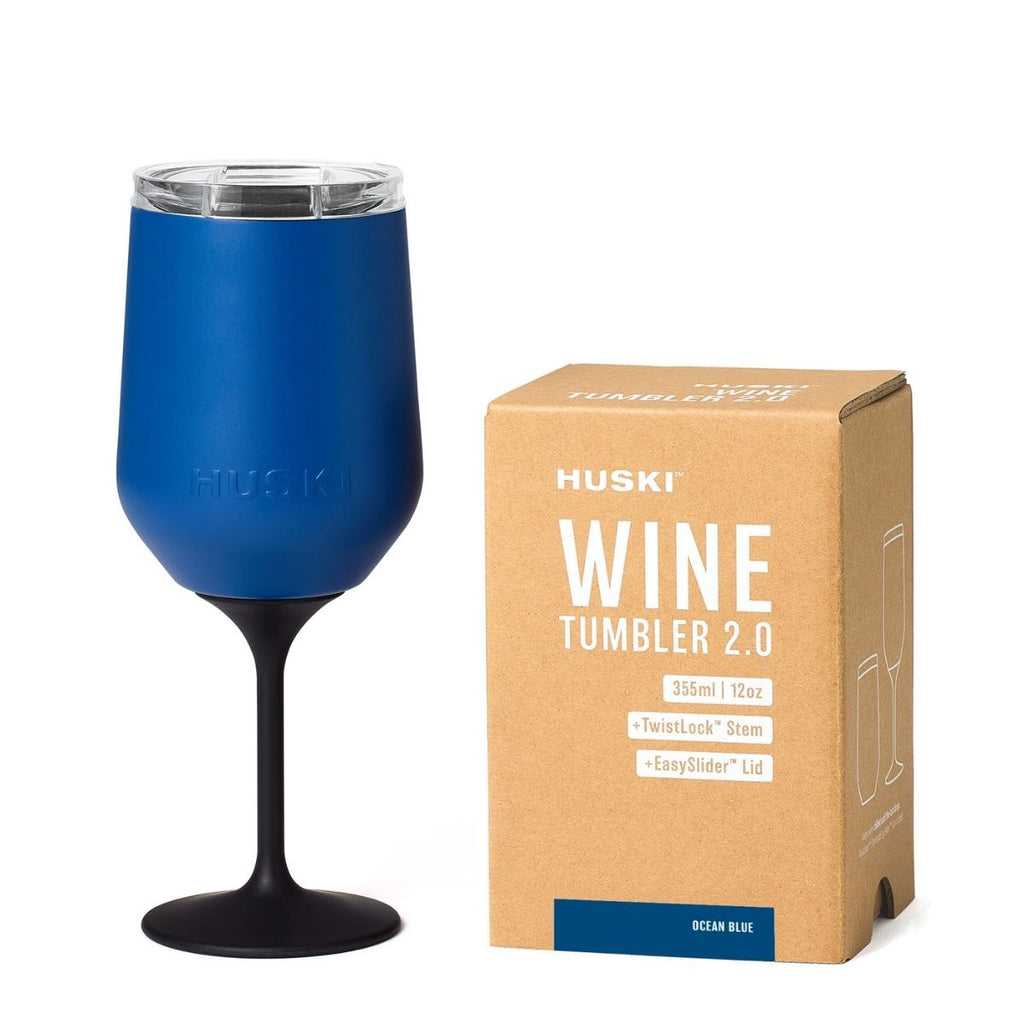 Blue wine tumbler with Huski packaging on a white background