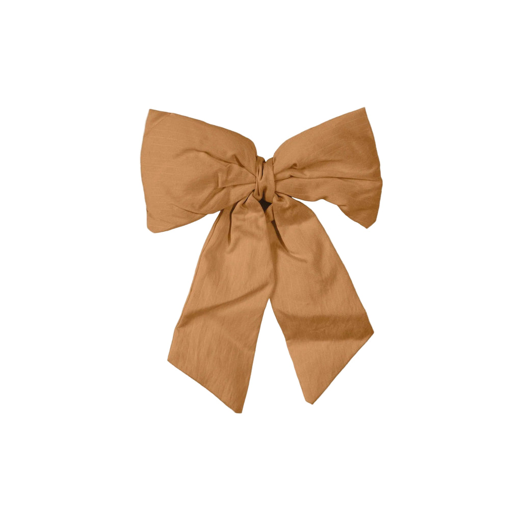Brown bow on a light gray background