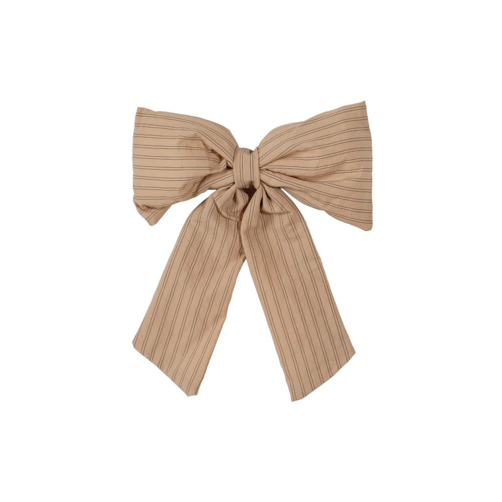 Beige ribbed bow on a light gray background