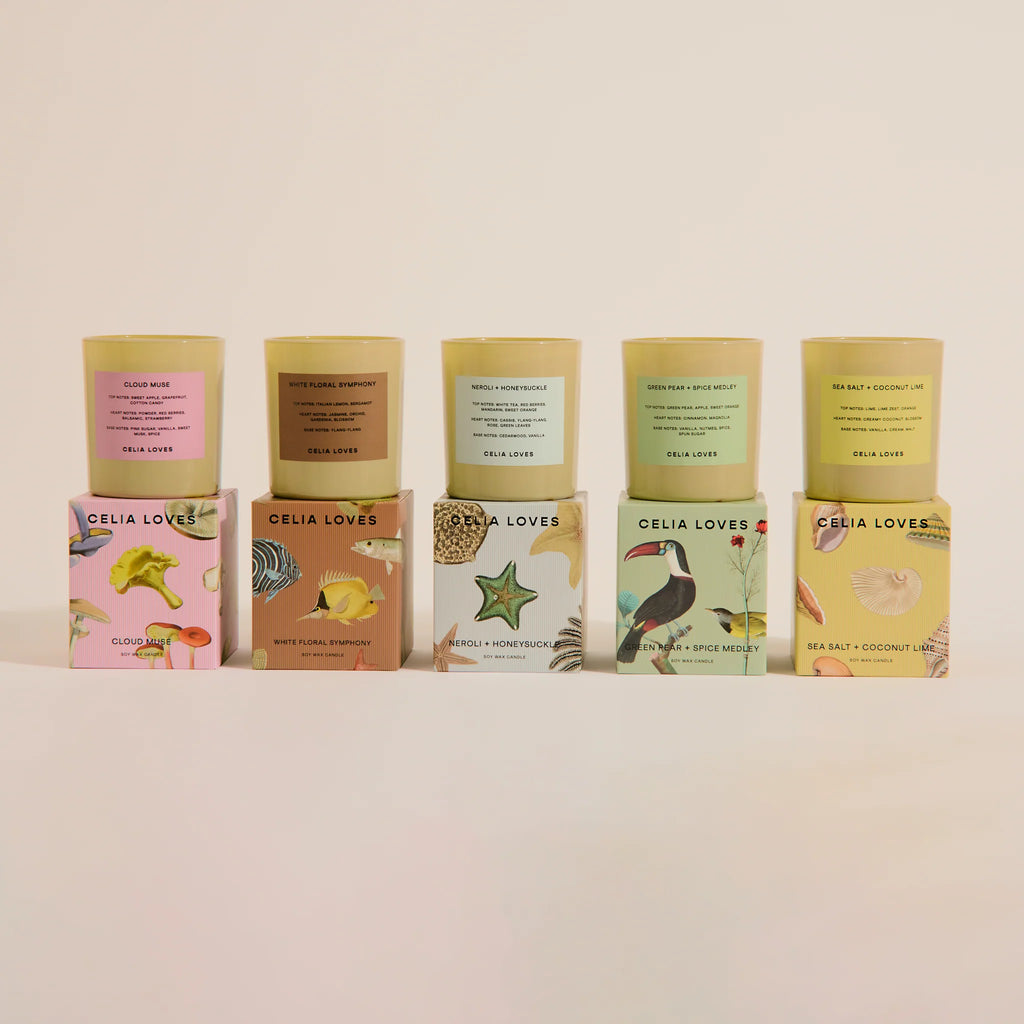 Row of Celia Loves candles and boxes on a light background