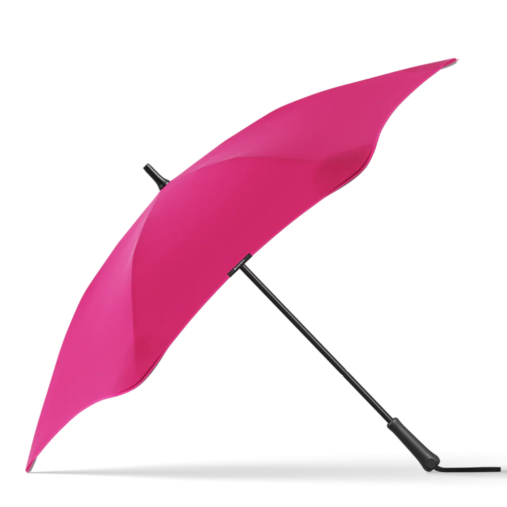 A pink and black handle blunt brand umbrella