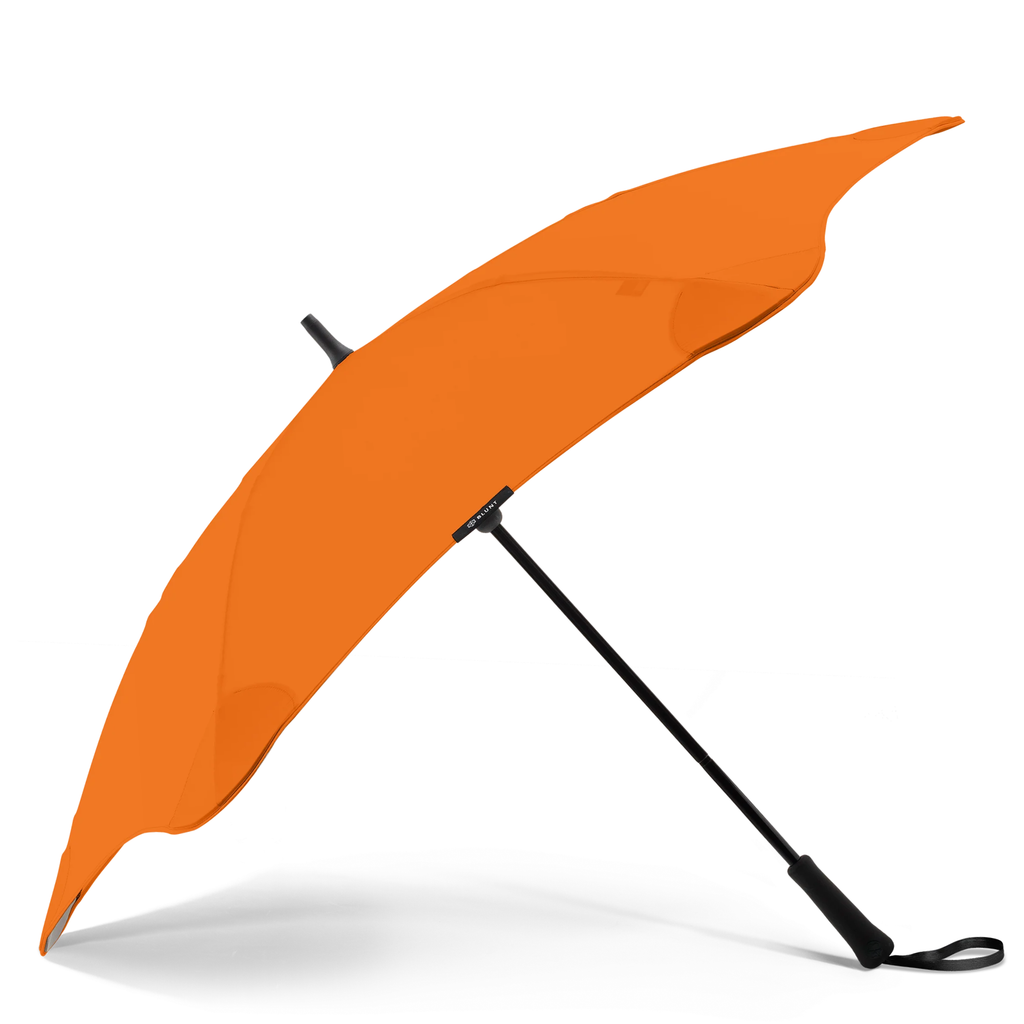 A orange and black handle blunt brand umbrella