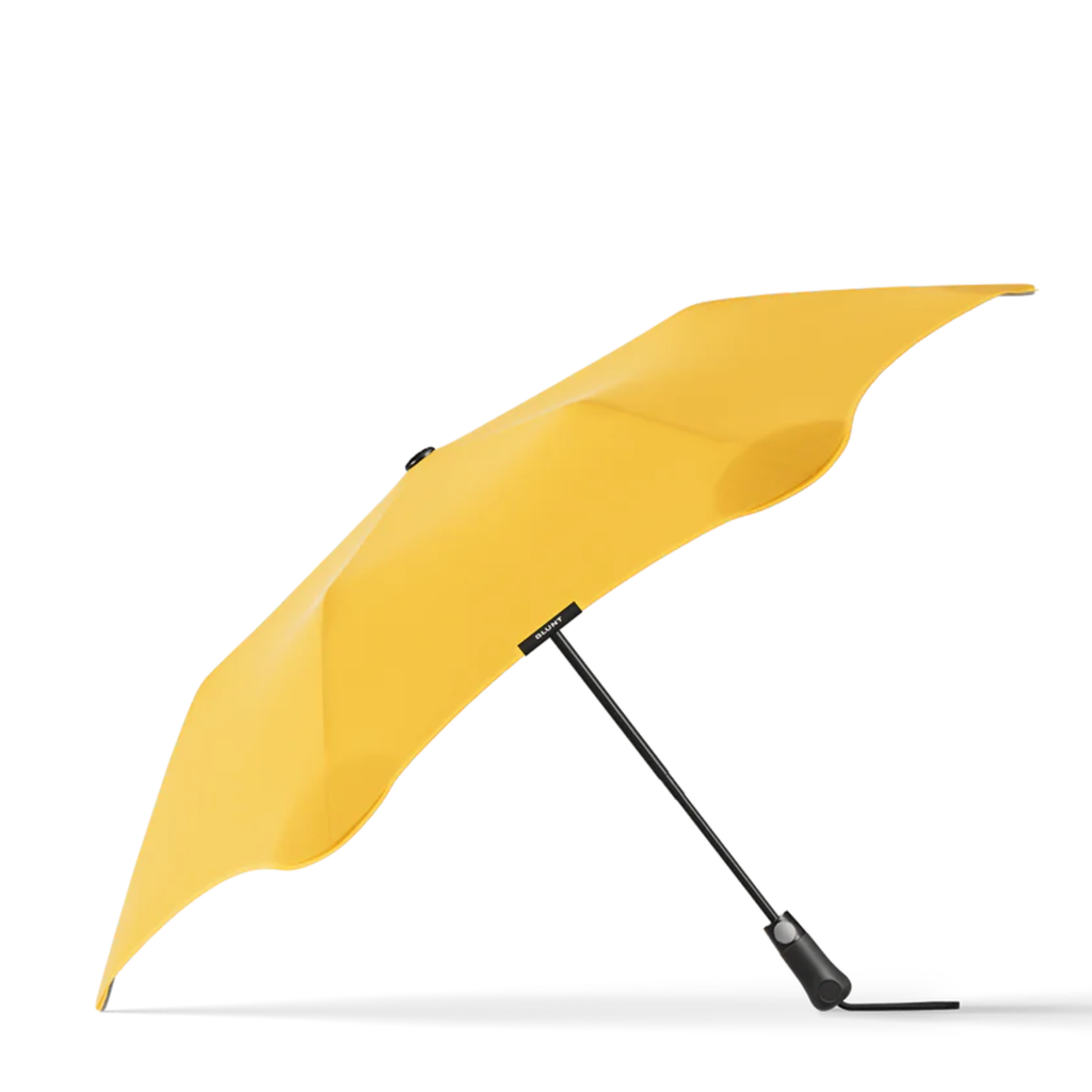A yellow and black handle blunt Metro brand umbrella