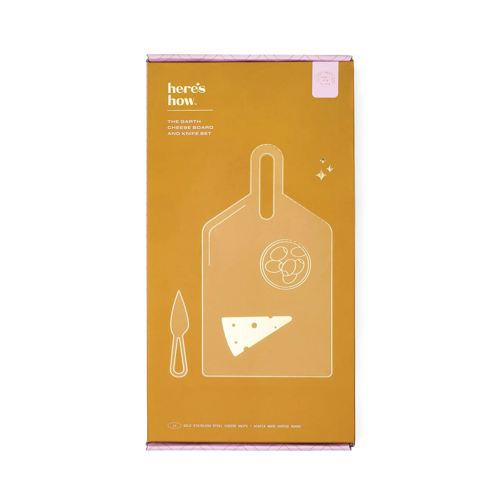 Cheese board and knife set packaging with 'here's how' branding on a white background
