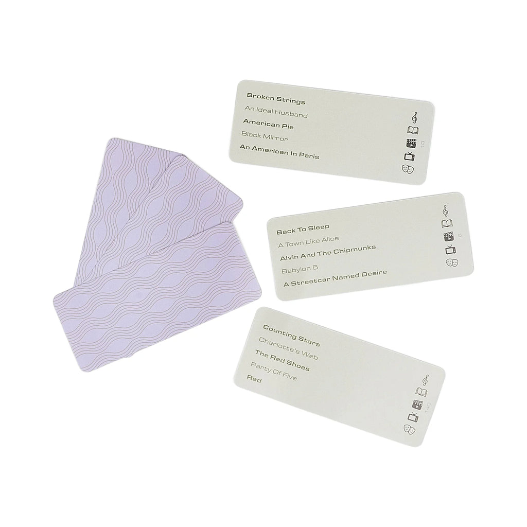 Set of cards with a purple card on a white background