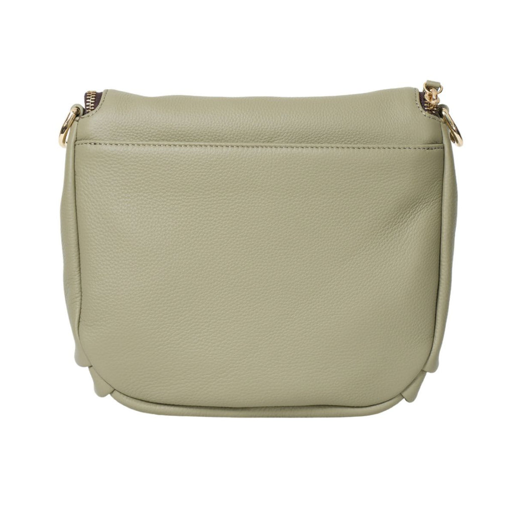 Green leather handbag on a white background
