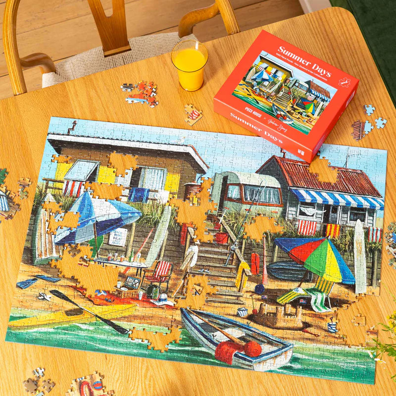 a jigsaw puzzle on a table next to packaging box