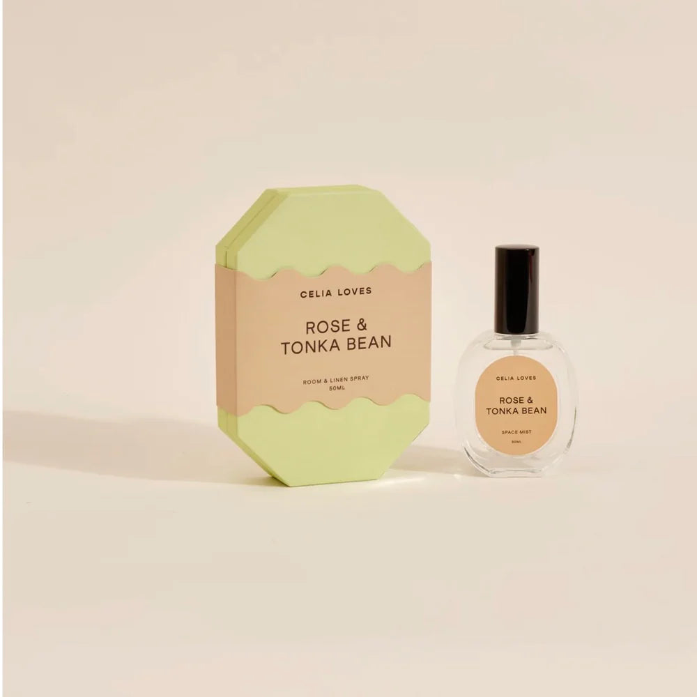Celia Loves Rose & Tonka Bean product packaging and bottle on a beige background