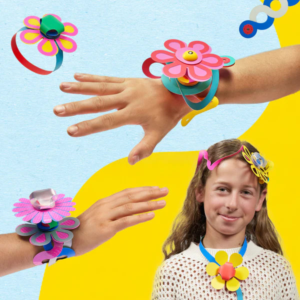 Children wearing colorful flower-shaped headbands and bracelets on a bright background
