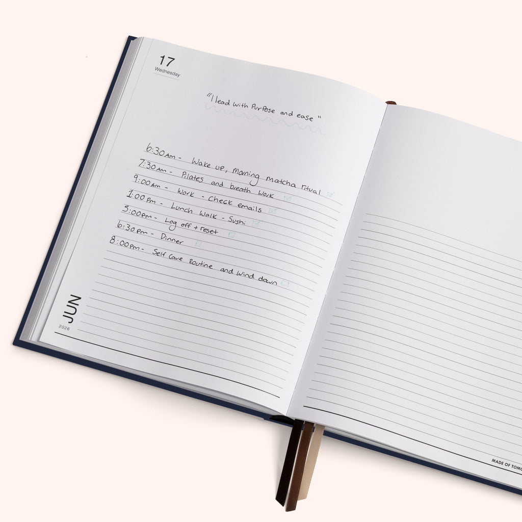 Open notebook with a daily schedule written on a white background