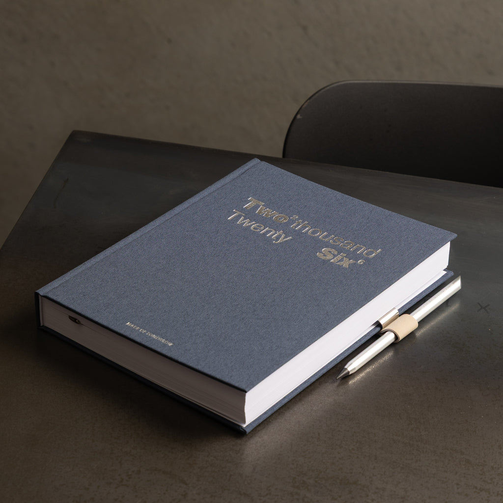 Blue book with gold text on a dark surface