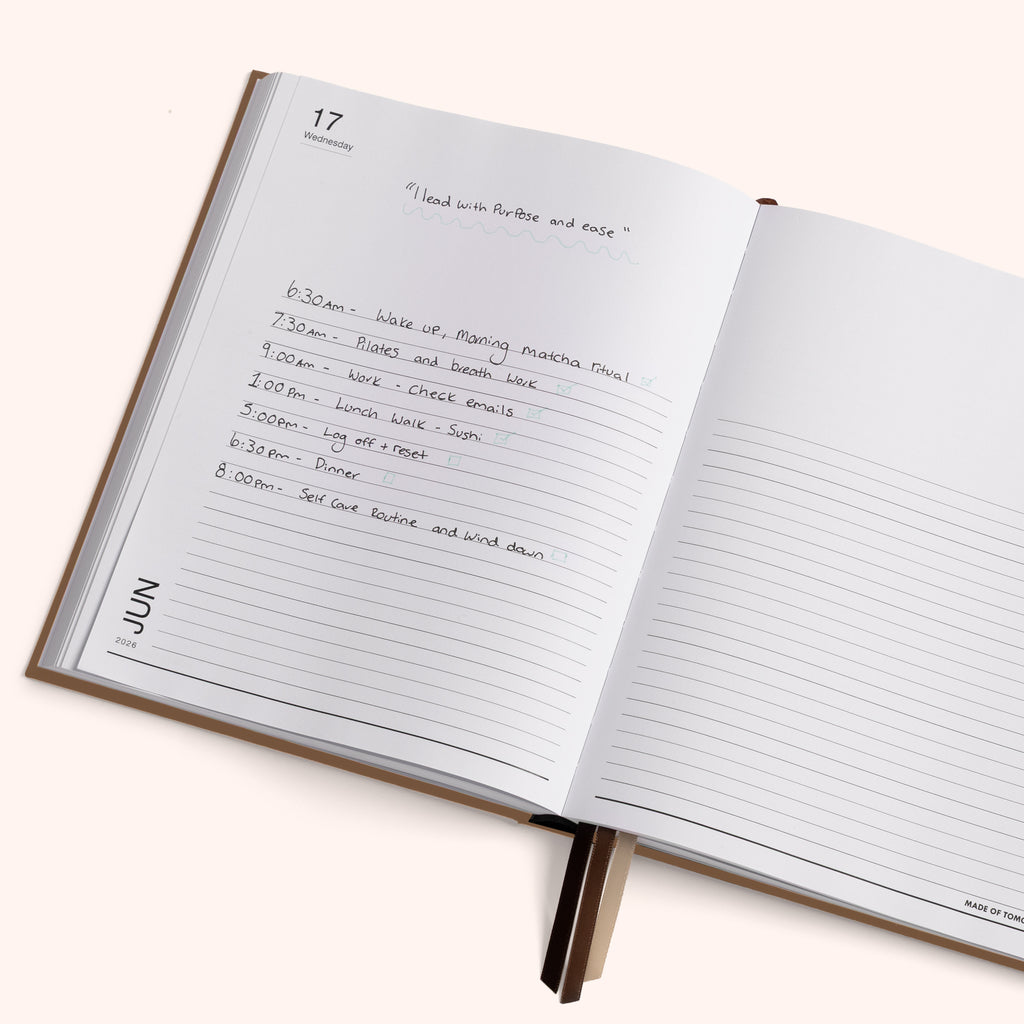 Open notebook with a daily schedule written on a white background