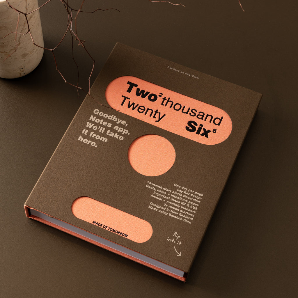 Book with 'Two Thousand Twenty Six' design on a dark surface