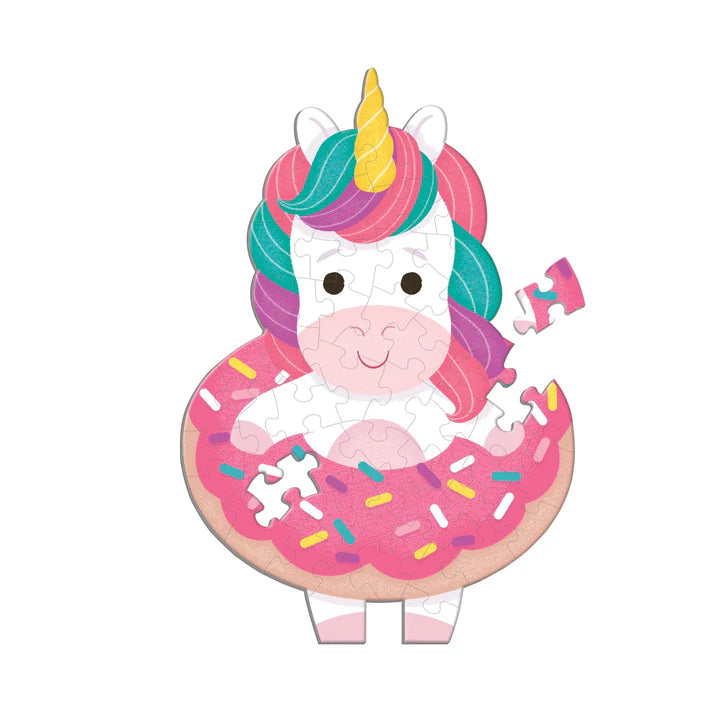 Unicorn-shaped puzzle with a pink donut on a white background