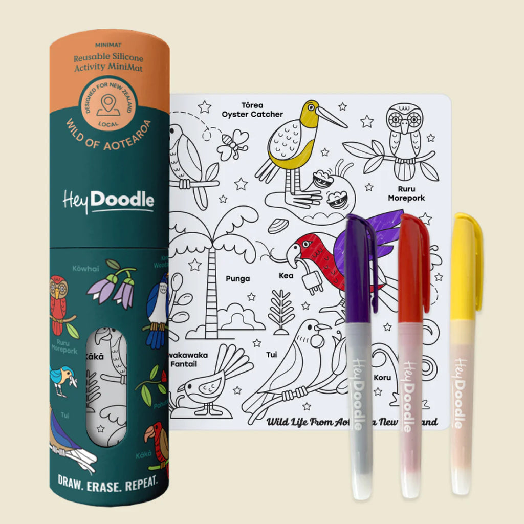 HeyDoodle product set with coloring book and markers on a beige background