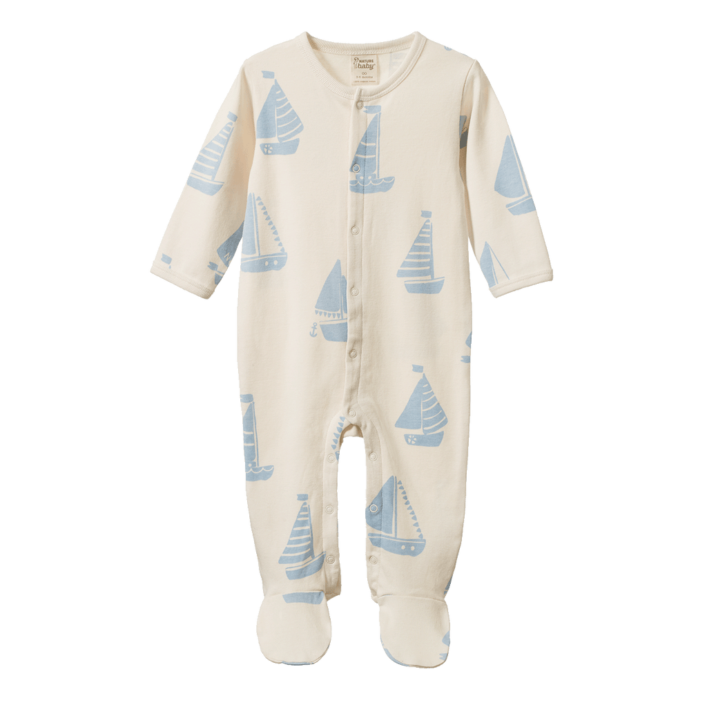 Baby onesie with sailboat pattern on a white background