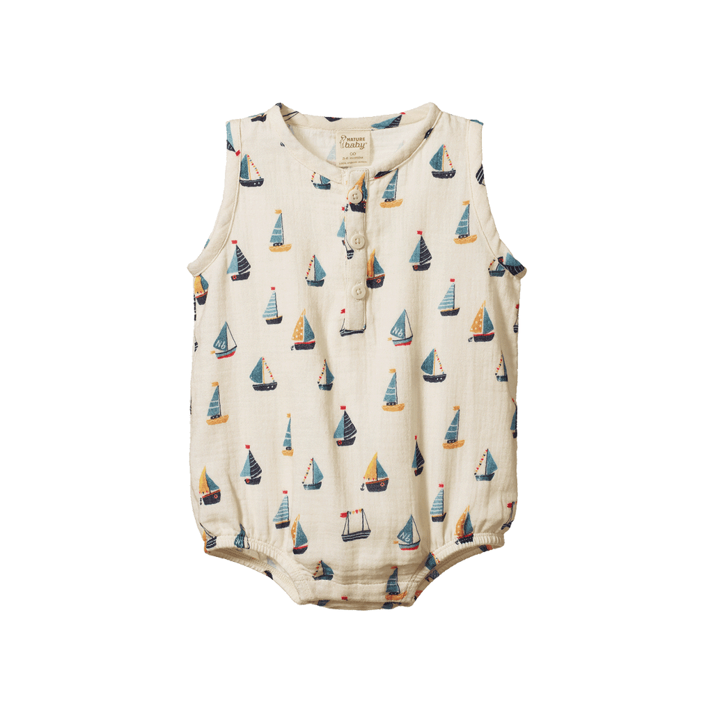 Baby romper with sailboat pattern on a white background