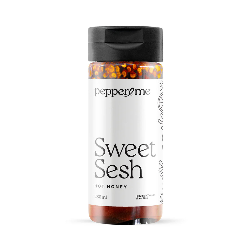 Bottle of 'Sweet Sesh' hot honey from Pepperme on a white background