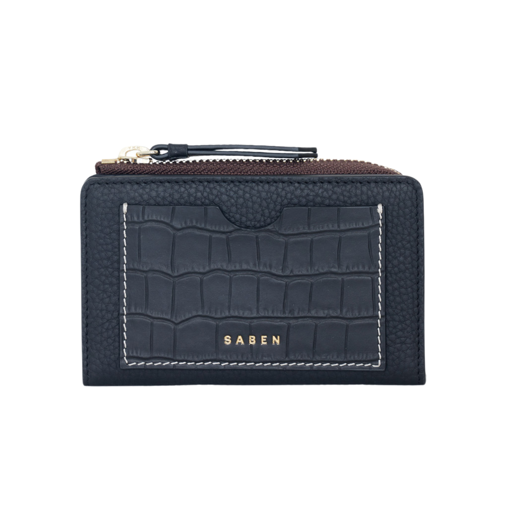 A navy leather zip wallet with a crocodile textured front compartment with gold Saben text branding