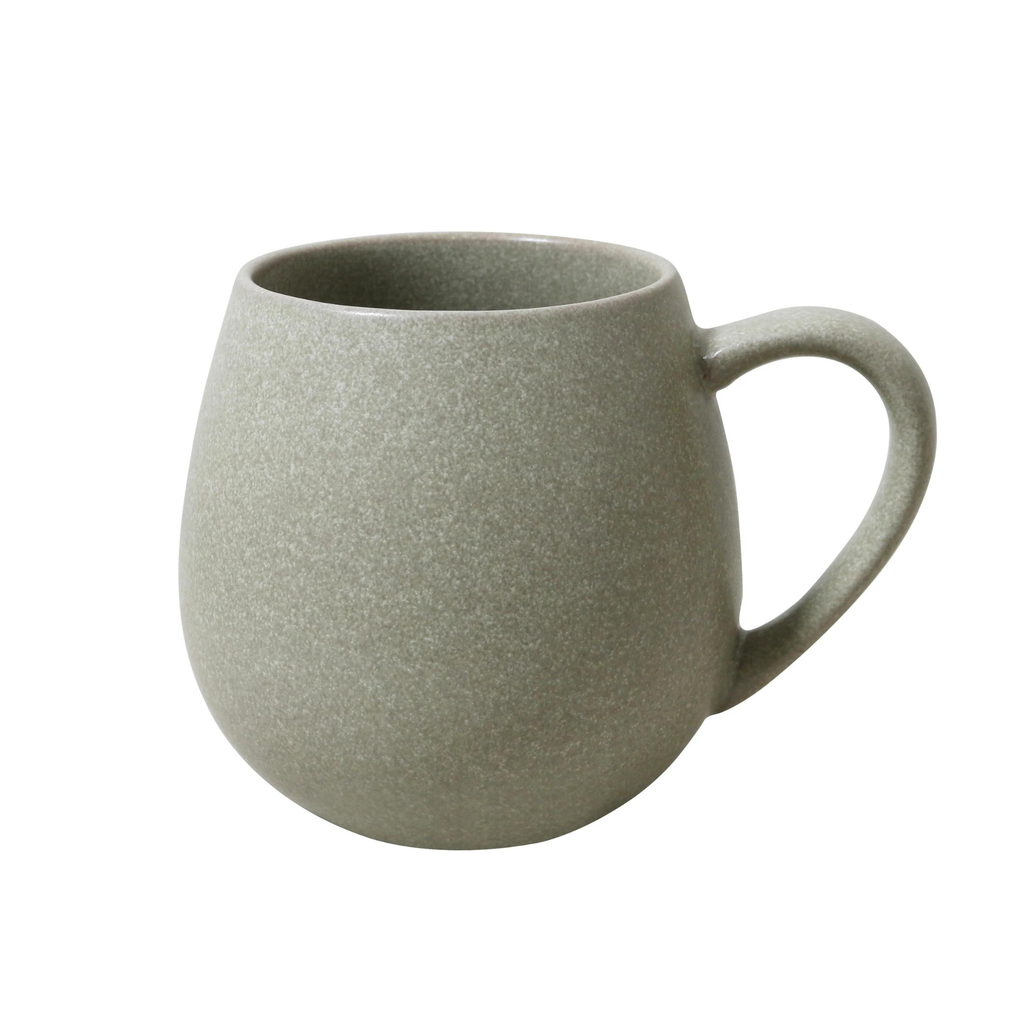 A rounded shape green mug with a handle on a white background