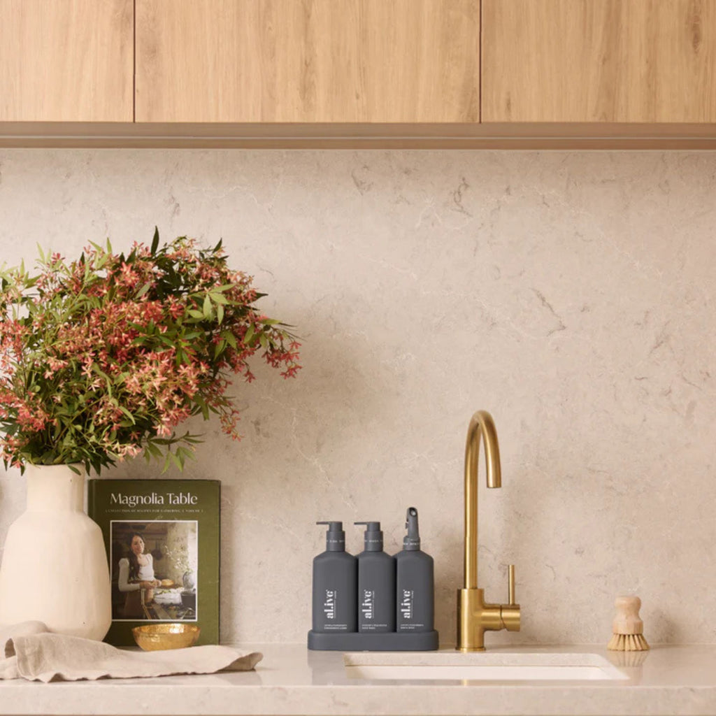 Set of 3 grey Al.ive products in a neutral kitchen setting