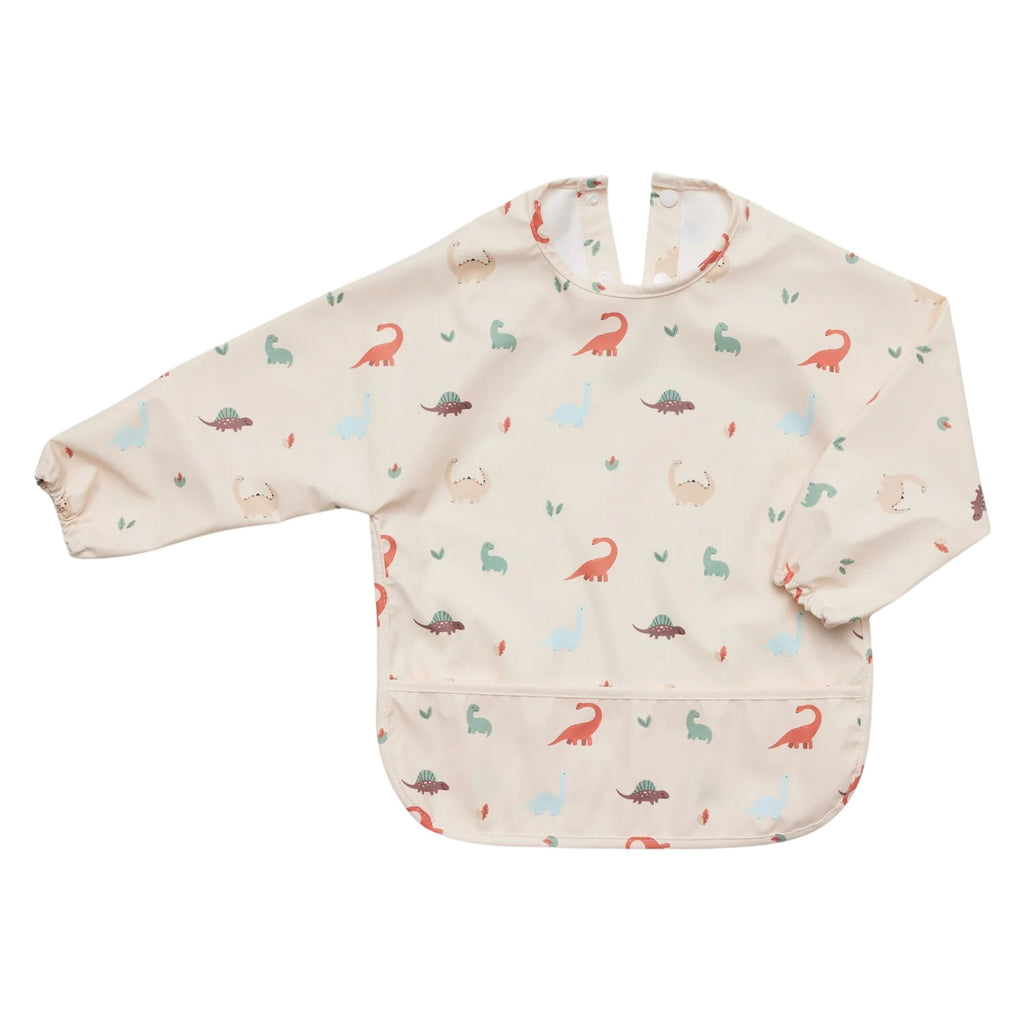 Cream Waterproof Long Sleeve Bib with orange, blue, brown and green dinosaurs on it and one arm folded