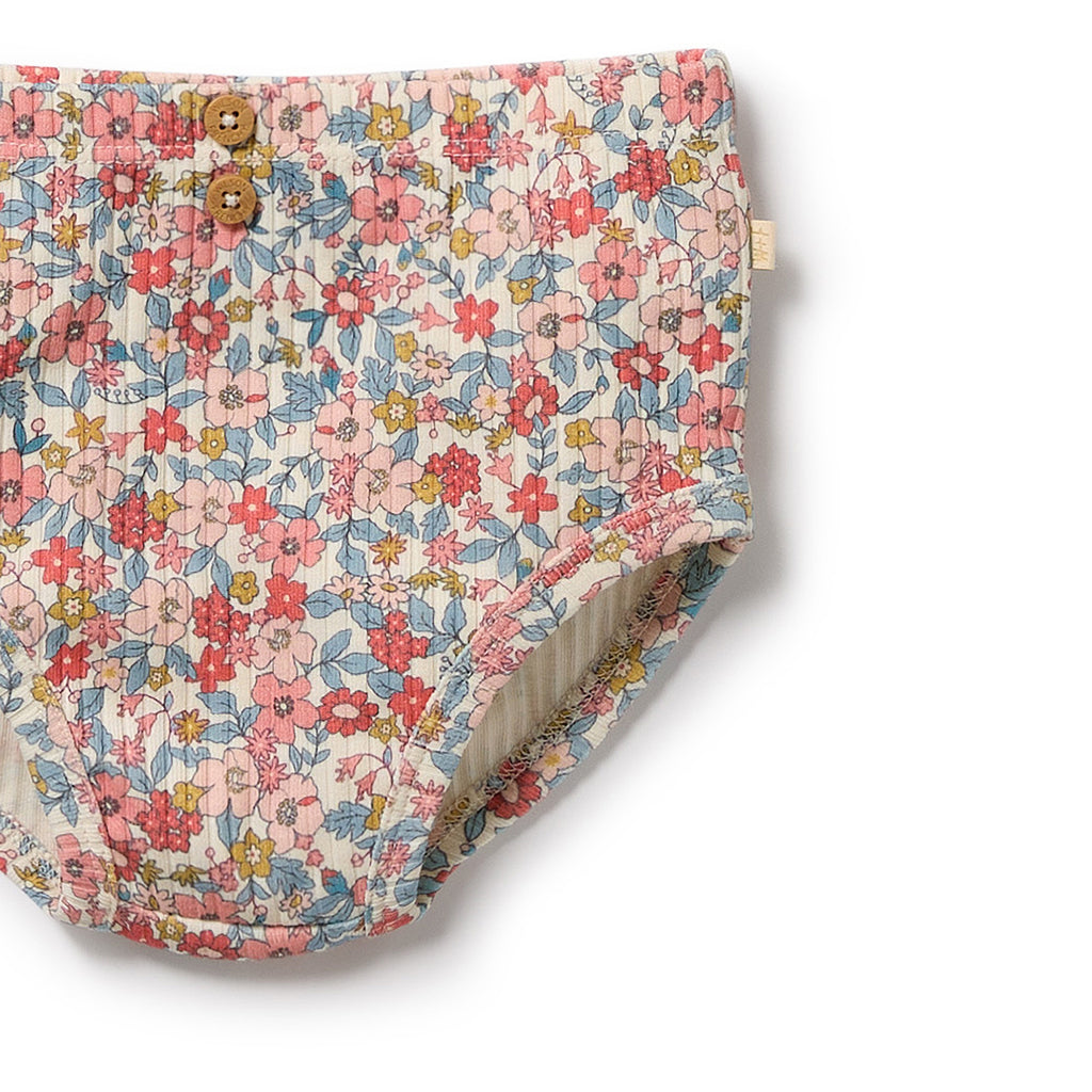Floral-patterned baby bloomers on a white background