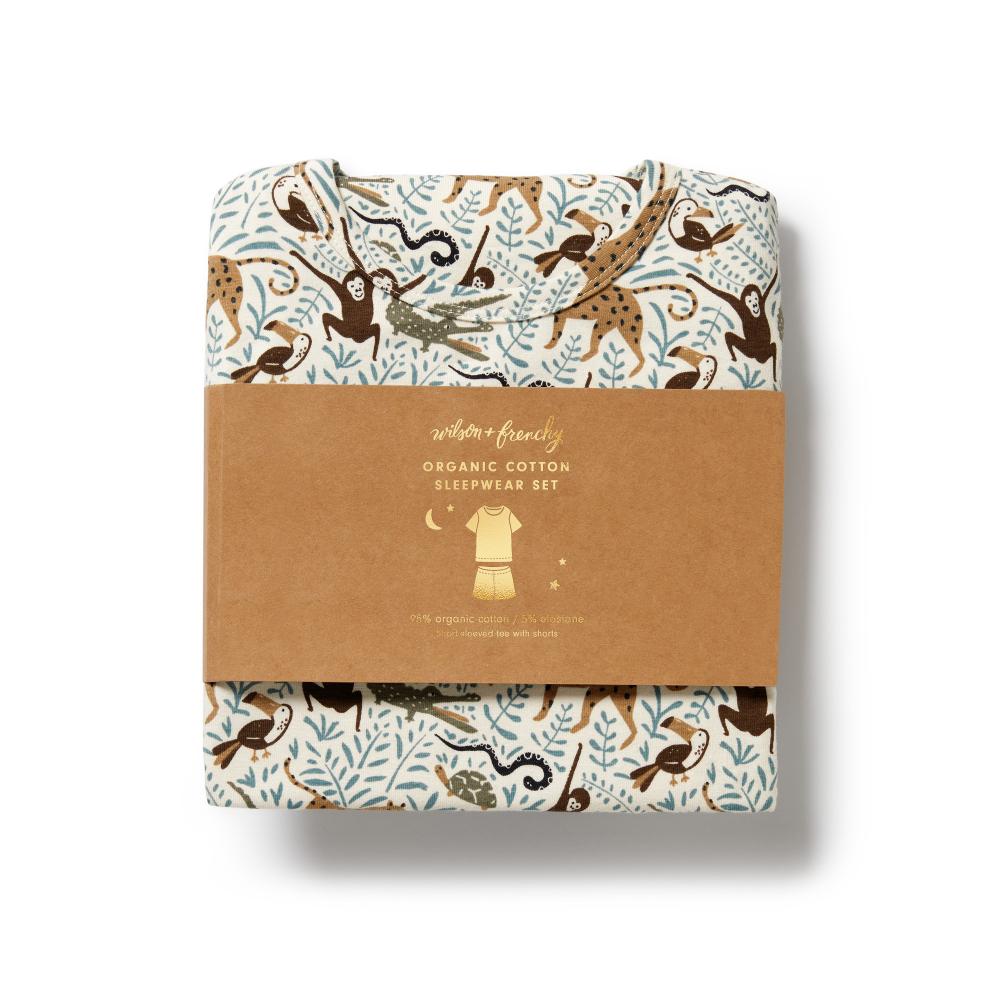 Packaged organic cotton sleepwear set with monkey and leaf pattern on a white background