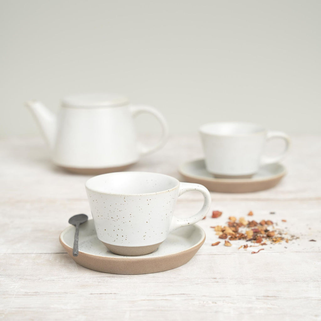Teapot - Ritual Speckled White ceramic. Picture shows two cups and saucers and a teapot