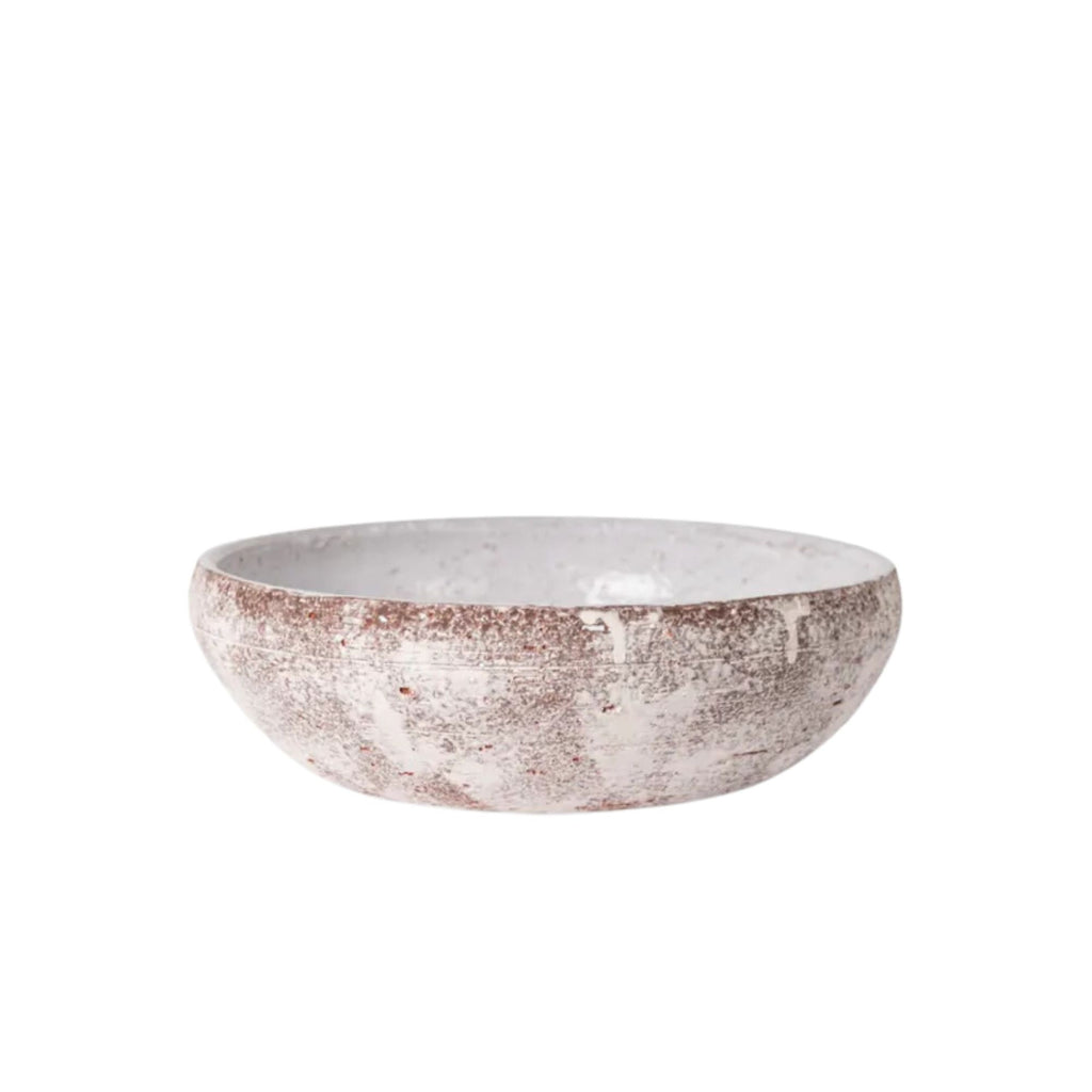 Ceramic bowl with a textured surface on a white background