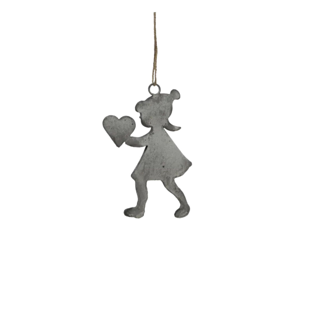 Metallic girl with heart ornament hanging on a white background