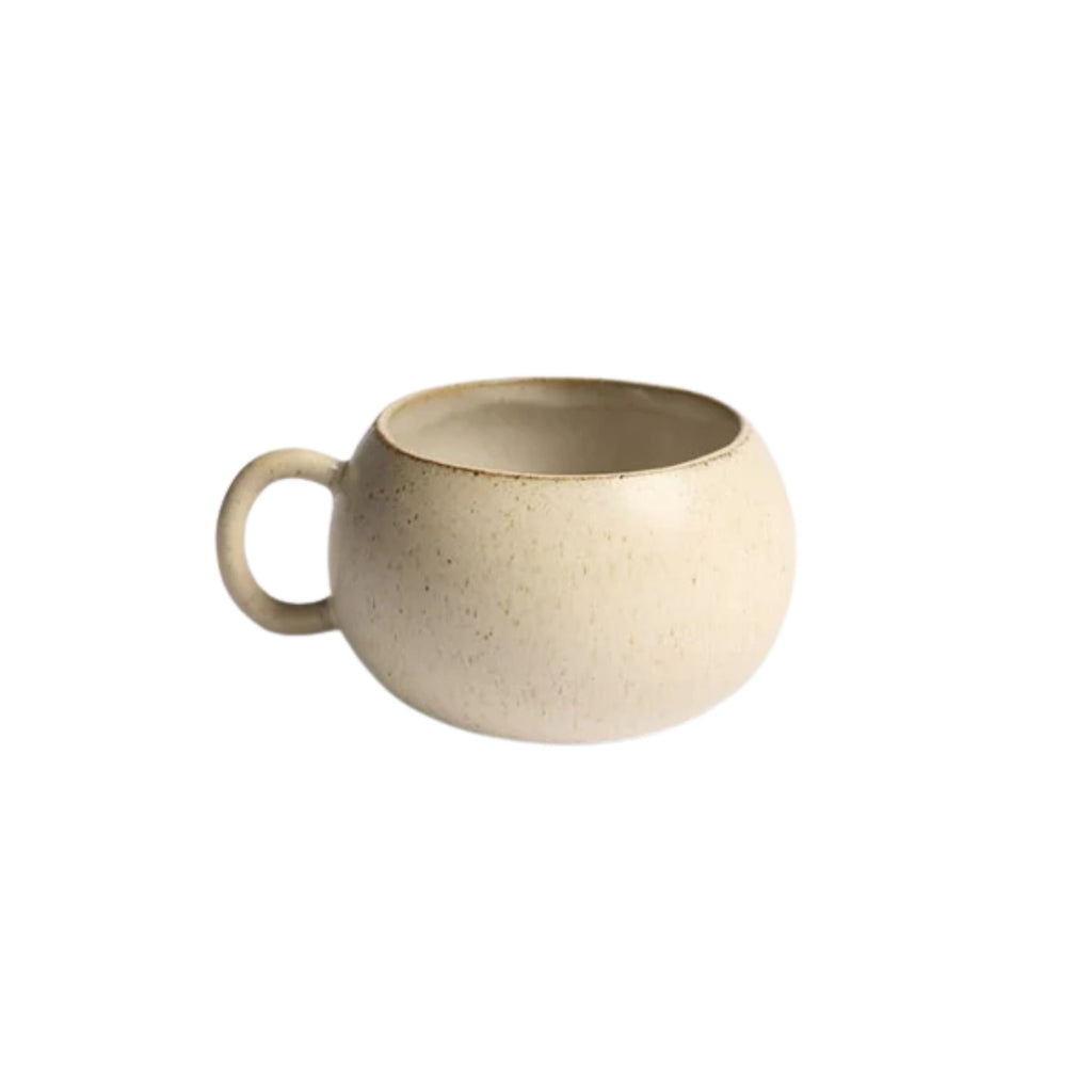 Beige ceramic mug on a white background