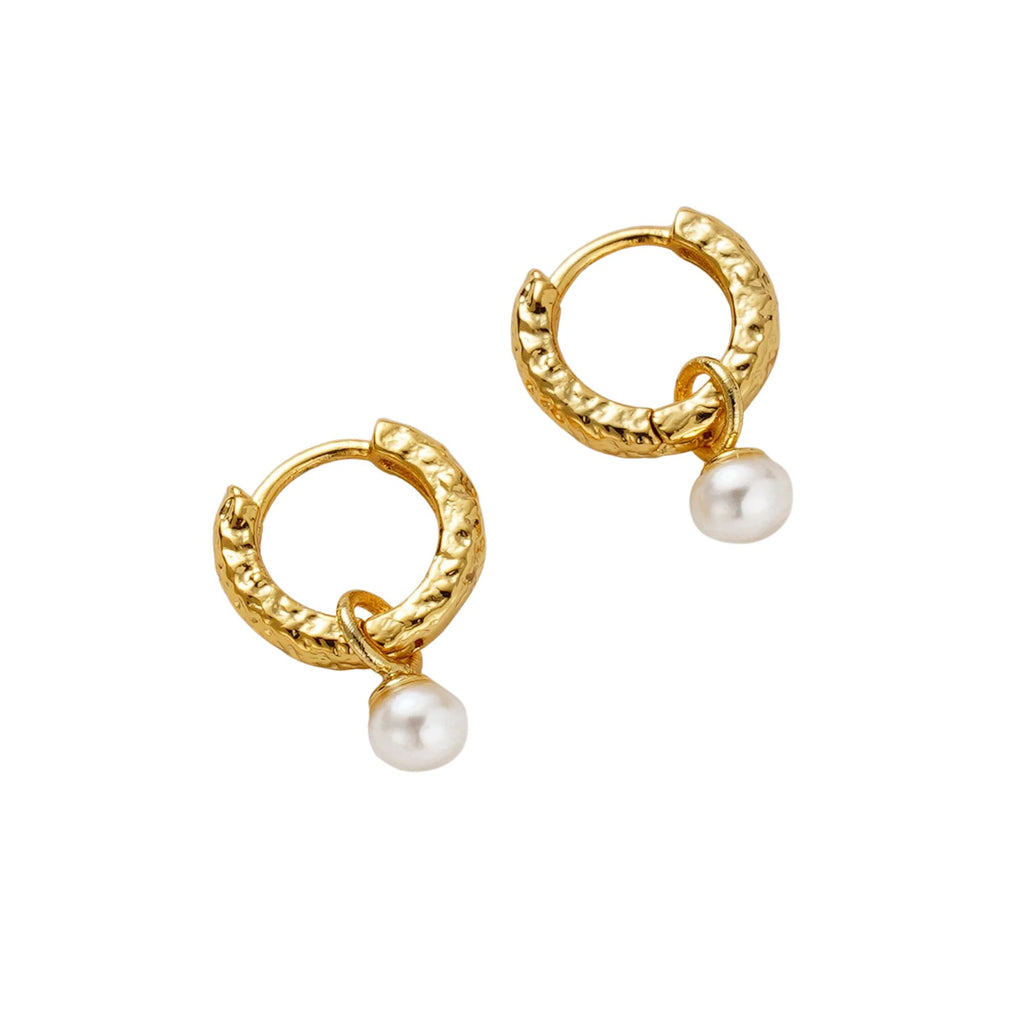 Gold hoop earrings with pearl drops on a white background
