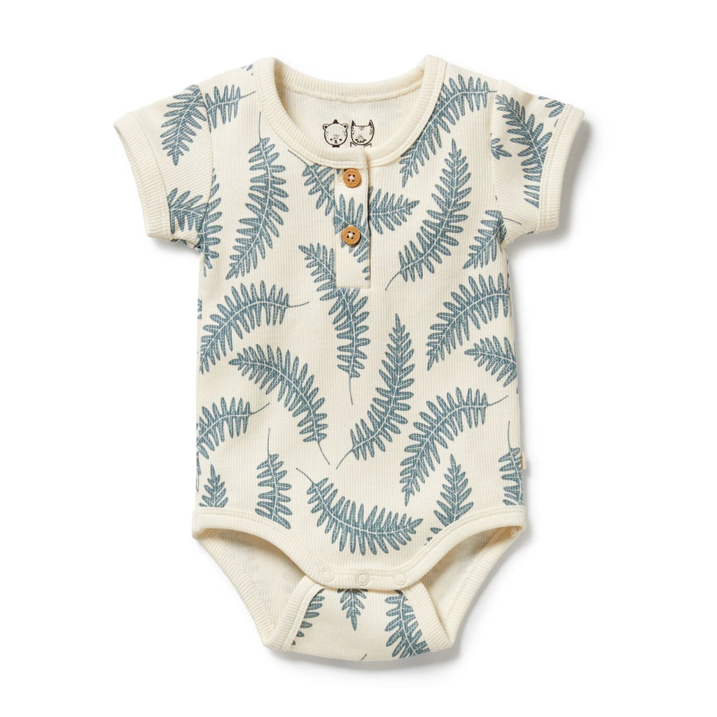 Baby onesie with fern leaf pattern on a white background