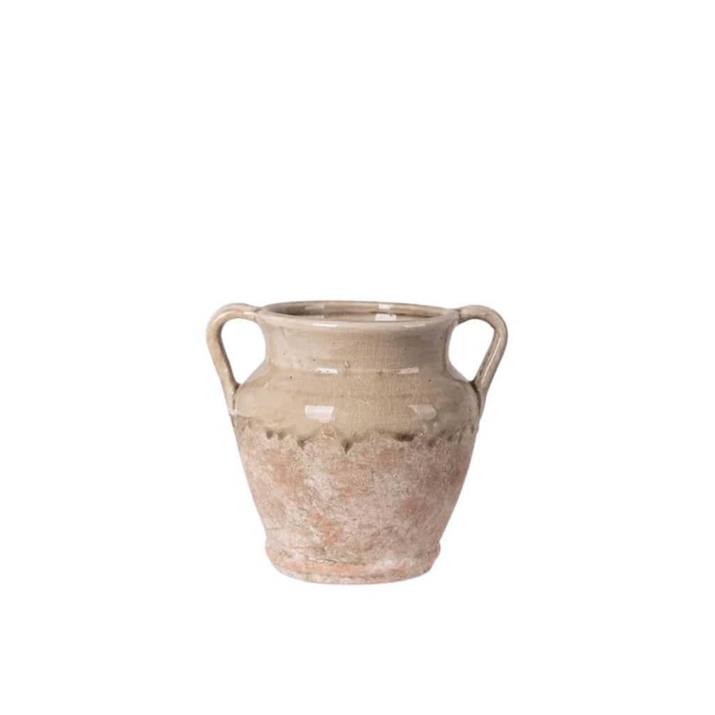 Ceramic vase with two handles on a white background