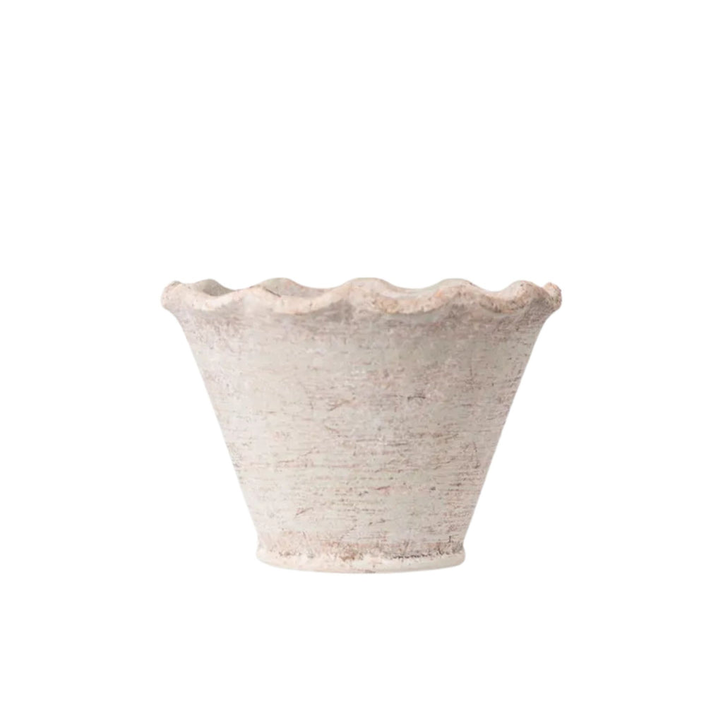Textured ceramic bowl on a white background