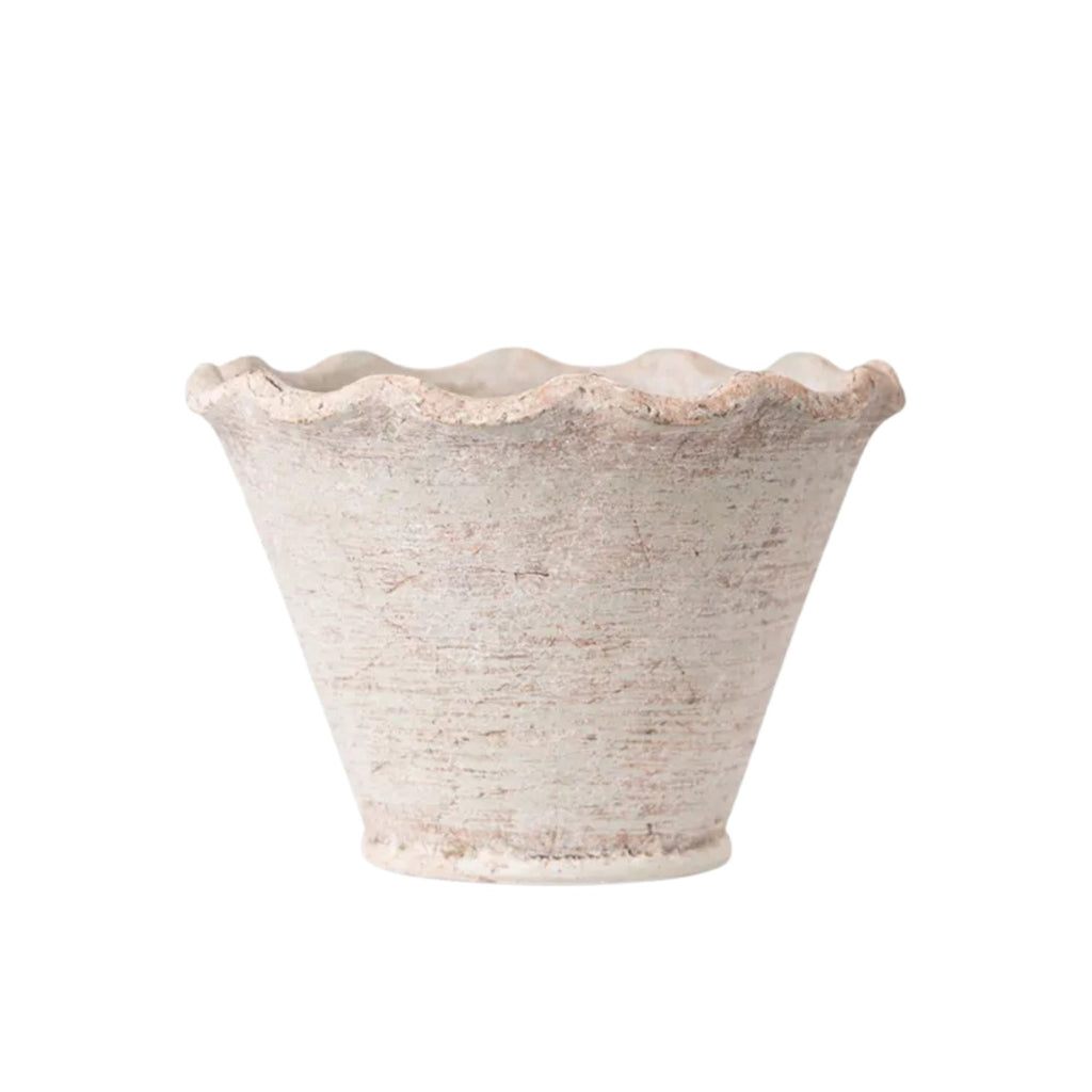 Textured cement planter on a white background