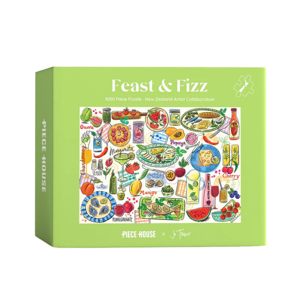Jigsaw puzzle box titled 'Feast & Fizz' with colorful illustrations on a green background