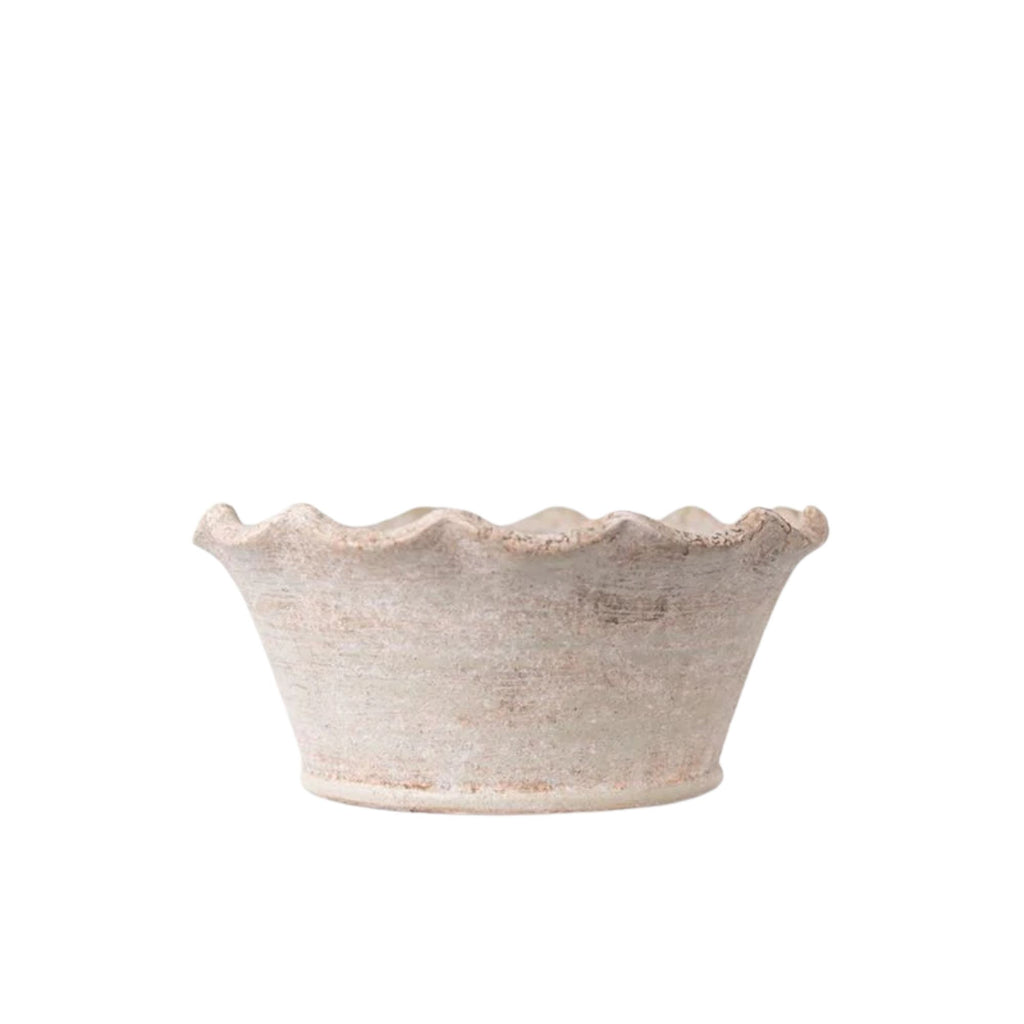 cement vase bowl with scalloped edge on a white background