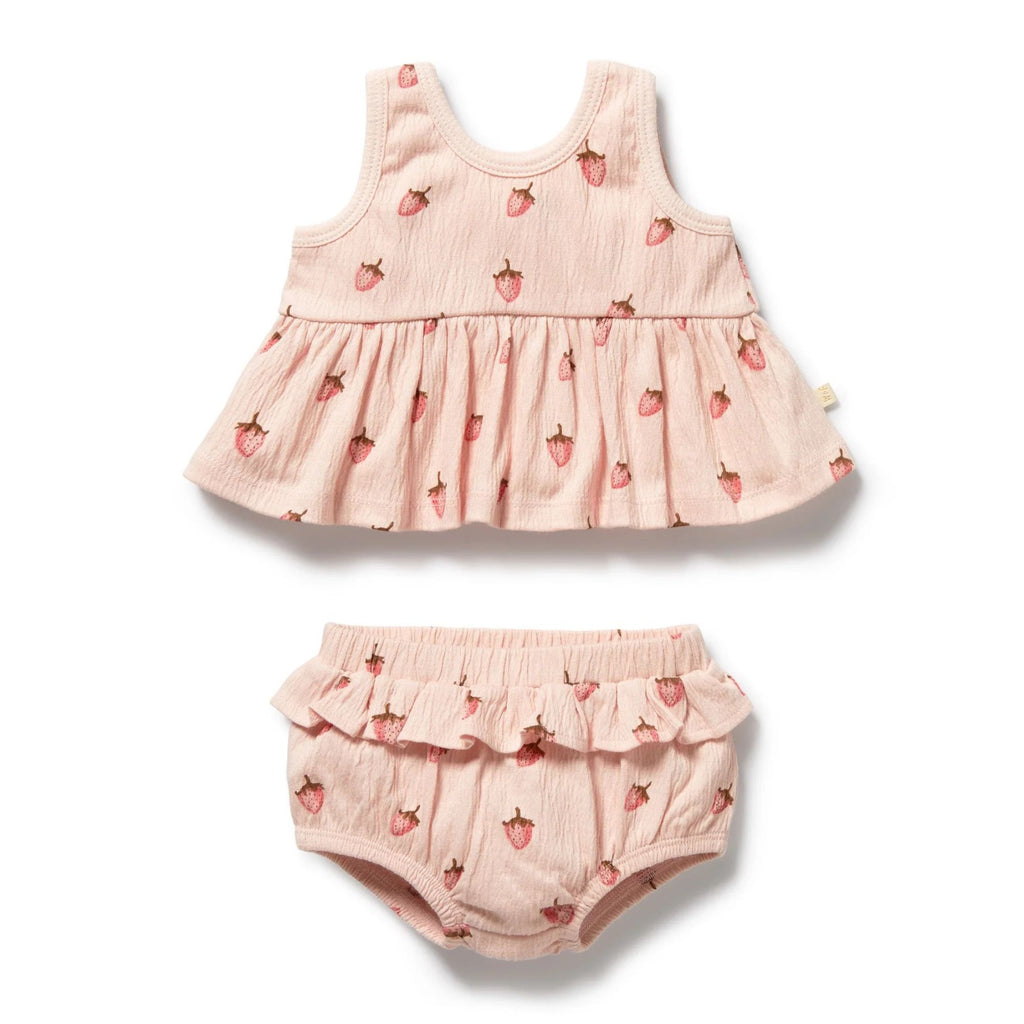 Pink baby dress with strawberry pattern and matching bloomers on a white background