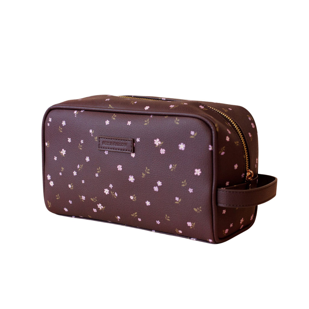 Brown toiletry bag with floral pattern on a white background