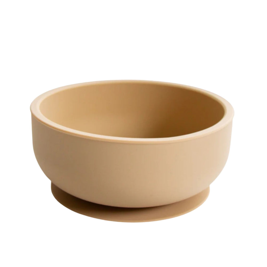 Beige silicone bowl on a white background