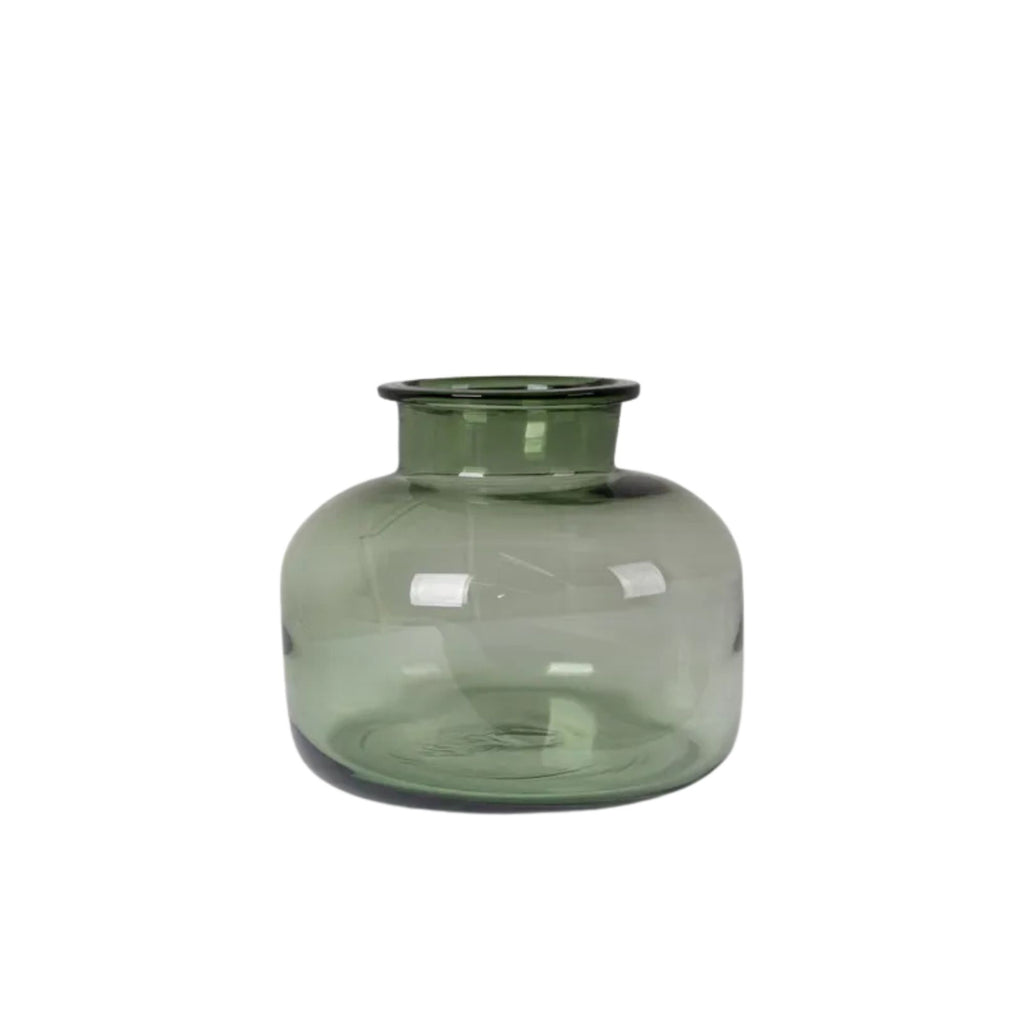 Green glass vase on a white background